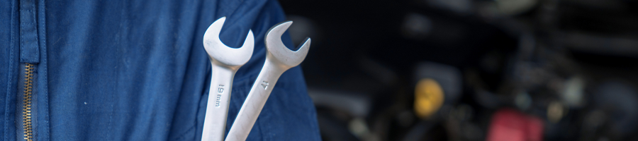 man holding spanners