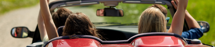 convertible driving with arms out