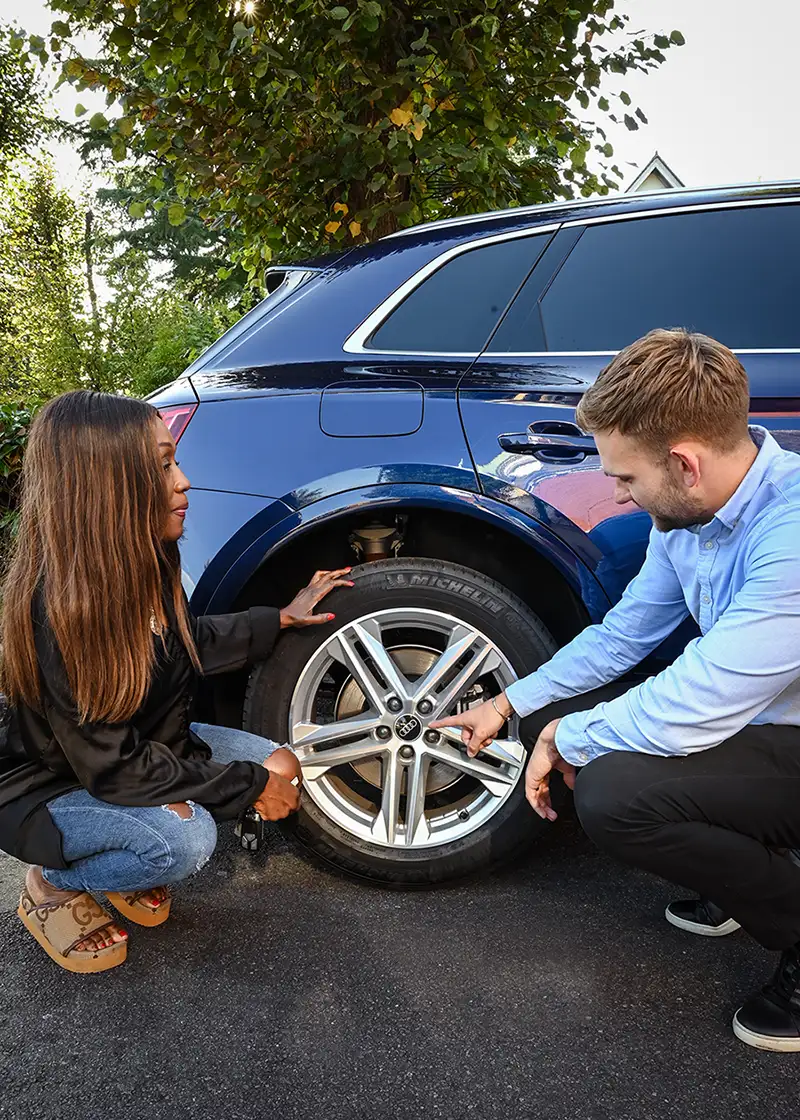 Diane Parish inspecting her new lease car